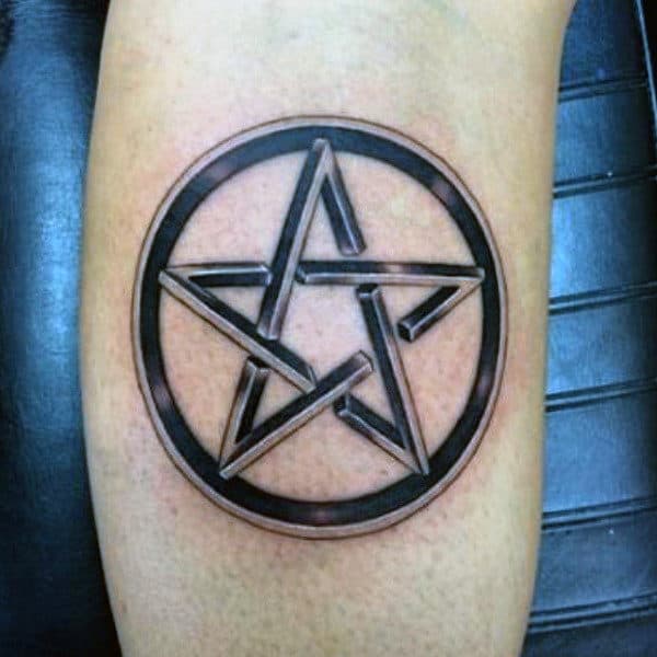 A tattoo of a 3D pentagram inside a circle on an arm