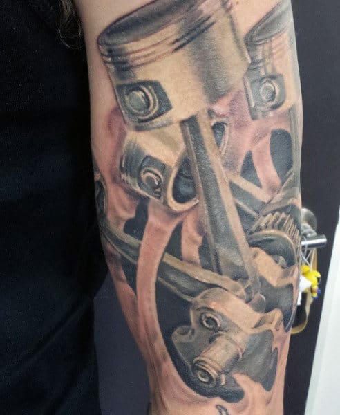 Black Pistons Tattoo On Men