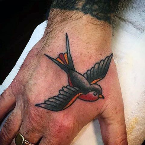 Black Red And Orange Guys Flying Sparrow Traditional Small Hand Tattoo
