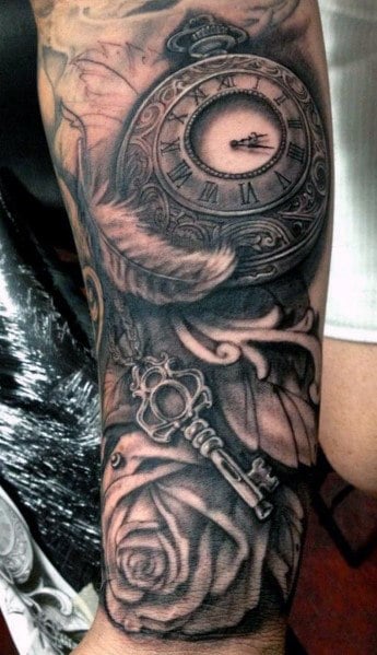 Tattoo of a pocket watch, key, and rose on an arm