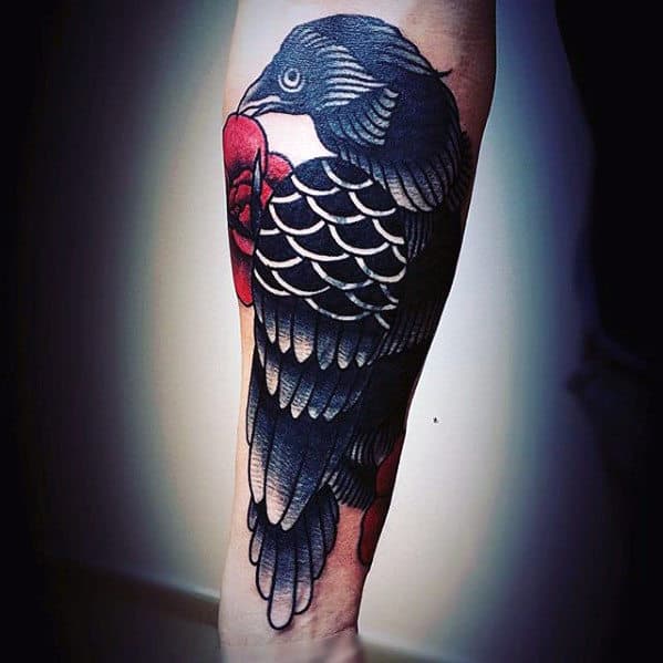 Black Traditional Crow With Red Flowers Mens Outer Forearm Tattoo