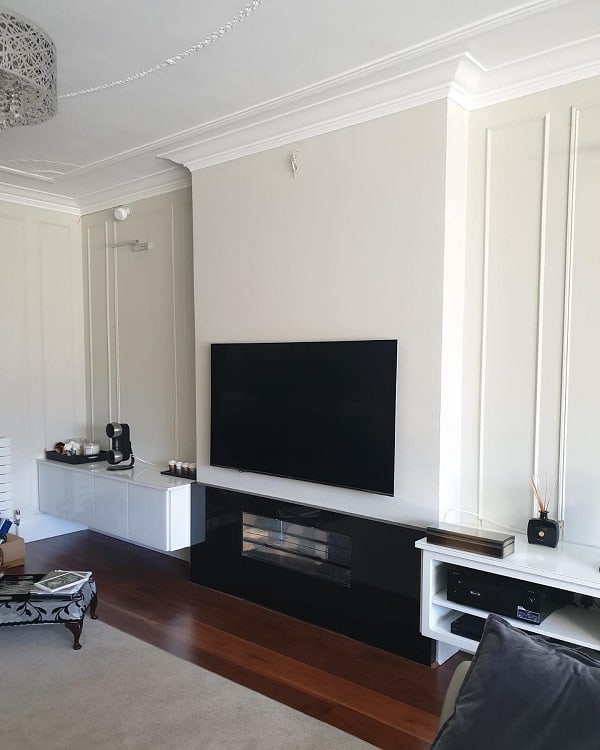 black fireplace white living room wall mounted tv