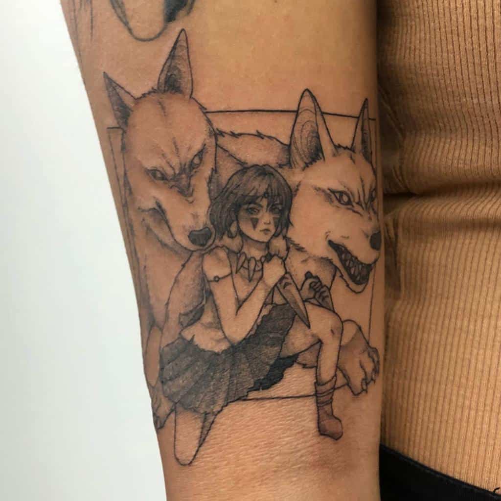 Black ink tattoo of San crouching with a dagger, flanked by Moro and her wolf siblings, framed like a film scene from Princess Mononoke.