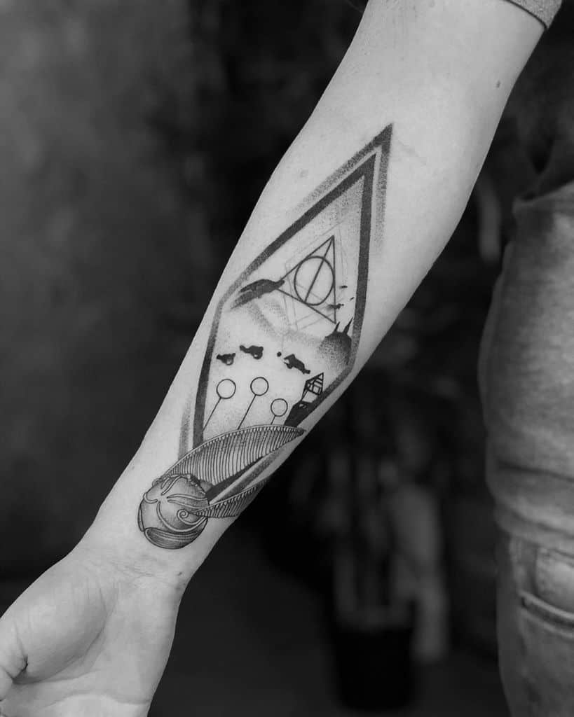 Black ink forearm tattoo featuring a Quidditch scene with a Golden Snitch, goalposts, the Deathly Hallows symbol, and Hogwarts in the background.