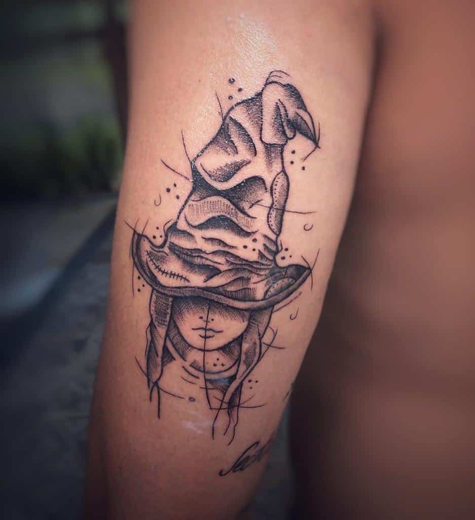 Detailed Sorting Hat tattoo with a mysterious face beneath, inspired by Harry Potter, symbolizing destiny and Hogwarts house selection