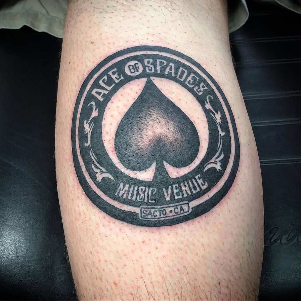 A black-and-white tattoo of the Ace of Spades symbol, framed by the text "Ace of Spades Music Venue" and "Sacto, CA" in circle
