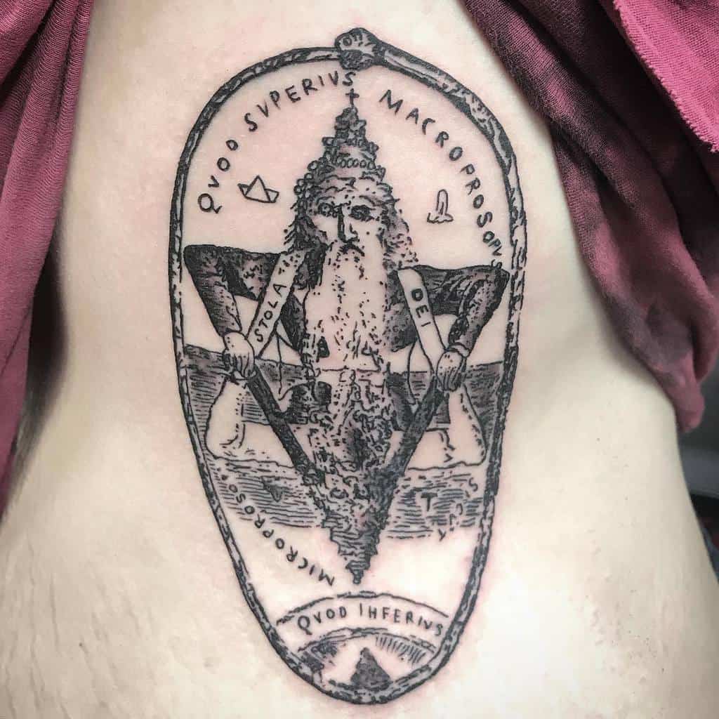 Detailed blackwork tattoo of an ancient figure within a symbolic frame, featuring Latin text 'Quod Superius Macroprosopus Quod Inferius.'