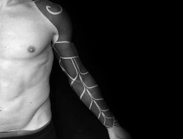 Blackout tattoo sleeve with geometric white line patterns, covering the arm and shoulder for a bold, modern, and abstract design.