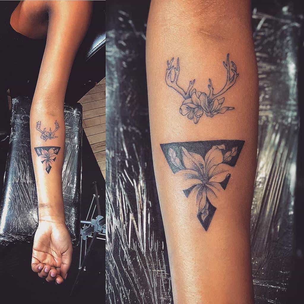 Arm tattoo featuring a lily flower within a triangle