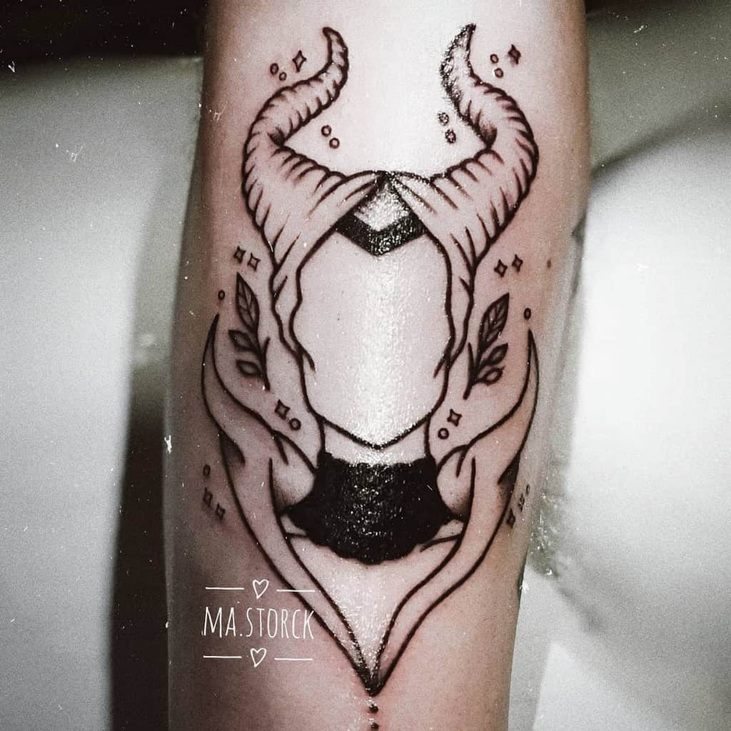 Minimalist blackwork tattoo of Maleficent with abstract details, featuring her iconic horns and decorative leaves for a modern look