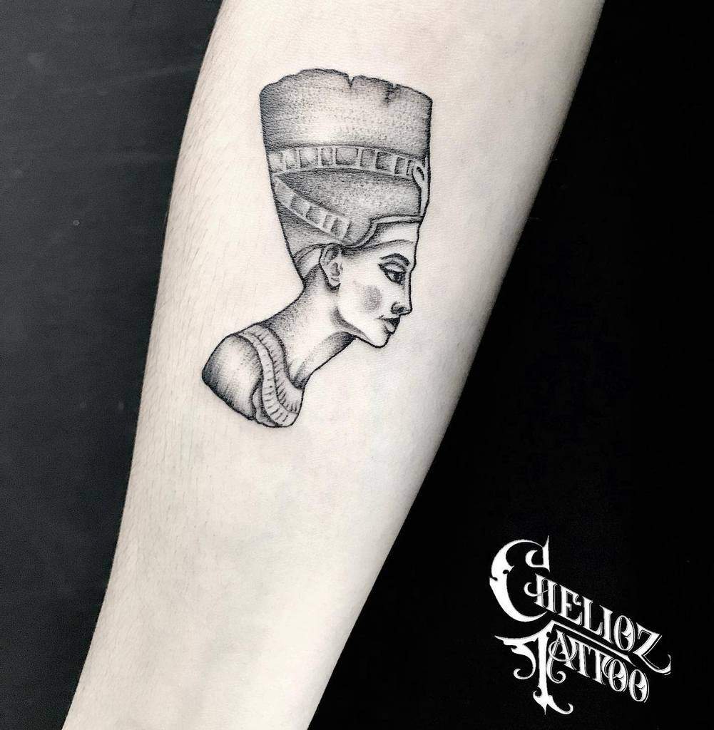 Tattoo of Queen Nefertiti's profile on an arm
