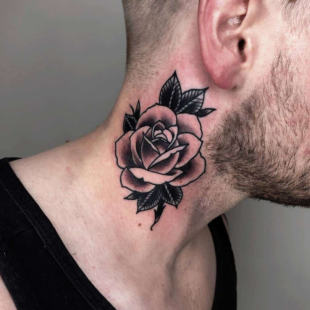A striking black and gray rose tattoo elegantly graces the side of a man's neck, adding an element of edgy sophistication