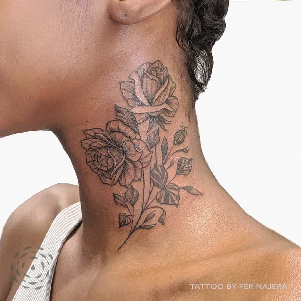 A stunning neck tattoo showcases detailed roses interwoven with leaves, beautifully adorning the skin
