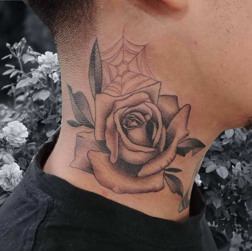 A striking neck tattoo featuring a rose with intricate leaves intertwined in a delicate spider web design