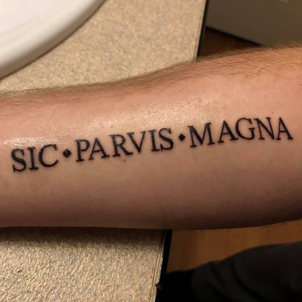 A tattoo on an arm reads "SIC • PARVIS • MAGNA" in bold letters