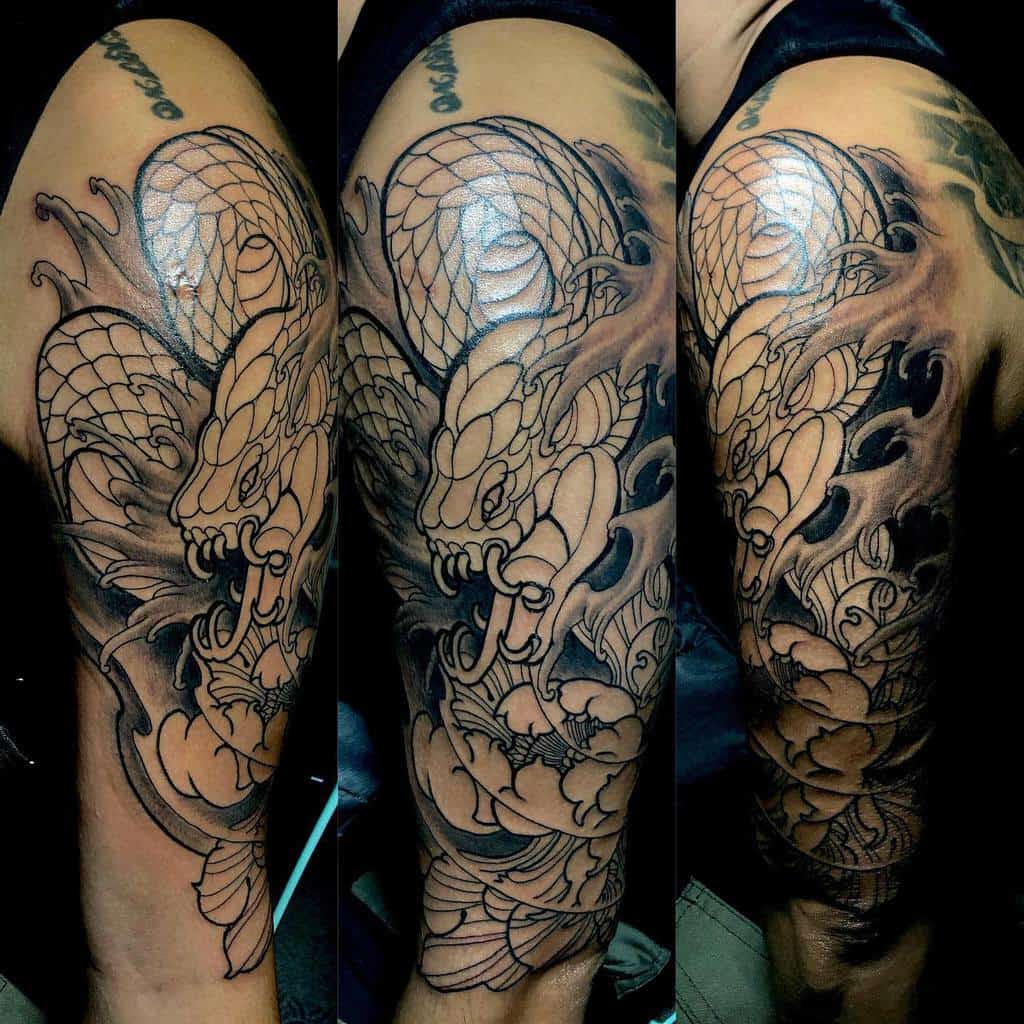 Tattoo sleeve with a detailed snake and waves design on an rm