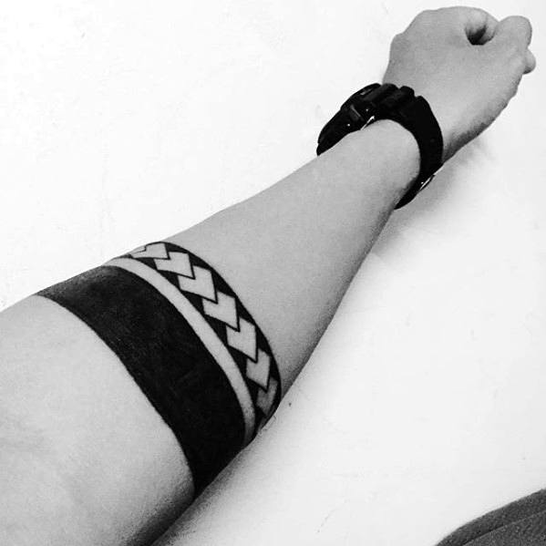 Blackwork With Negative Space Pattern Male Armband Tribal Tattoos