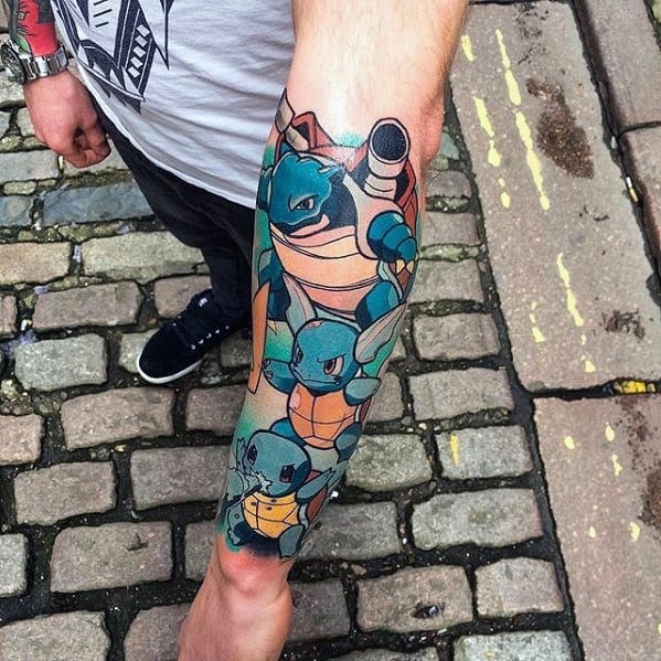 Forearm tattoo featuring Blastoise, Wartortle, and Squirtle in bold colors, stacked in an epic water-type evolution lineup.