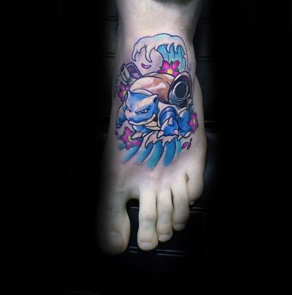 Vibrant Blastoise foot tattoo with ocean waves and pink flowers, blending power and elegance in a compact design.