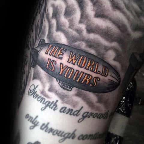 Blimp With Neon The World Is Yours Sign Mens Arm Tattoo