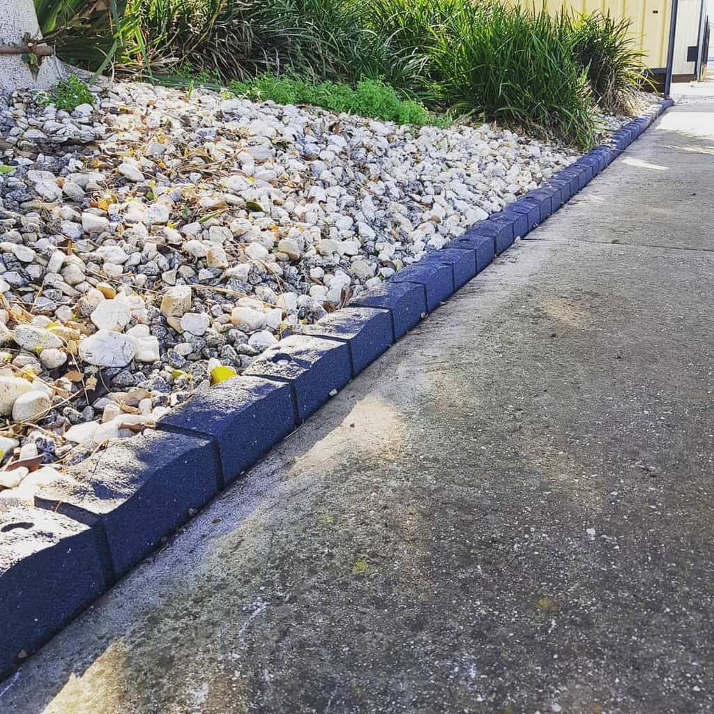 stone block garden edging concrete path