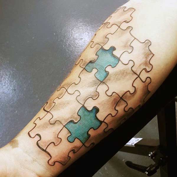 Blue 3d Puzzle Piece Tattoo For Men On Wrist