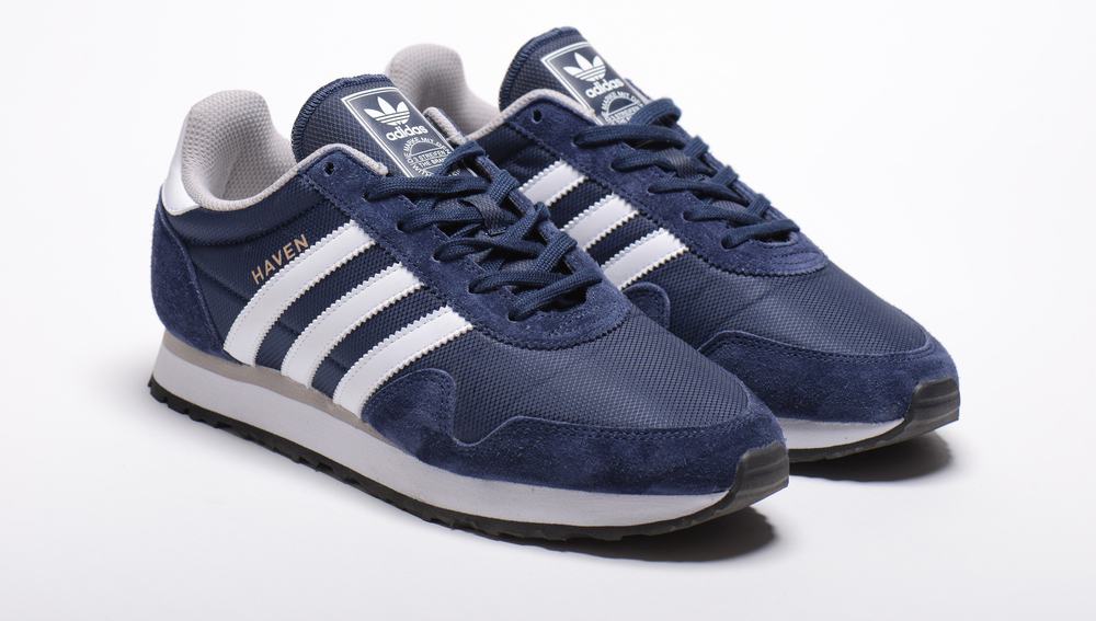 blue adidas shoes on white surface