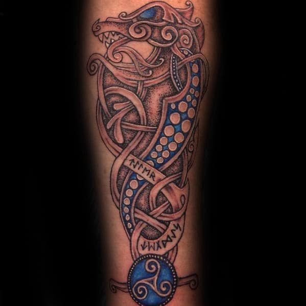 Blue and grey shaded Celtic dragon inner forearm tattoo