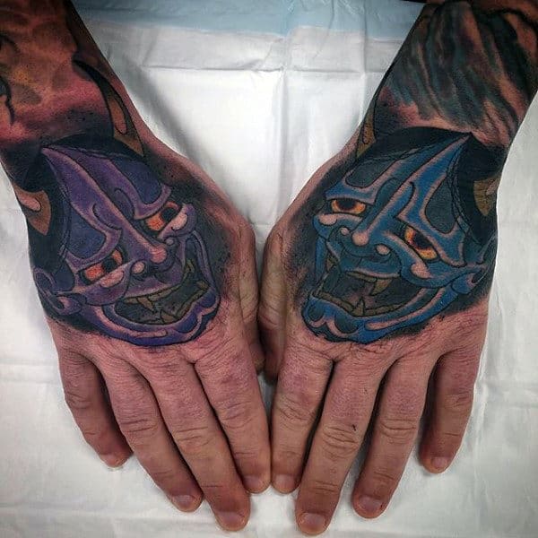 Blue And Purple Hannya Masks Tattoos On Mans Hands