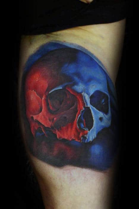 Blue And Red Ink Realistic Skull Mens Inner Arm Bicep Tattoo
