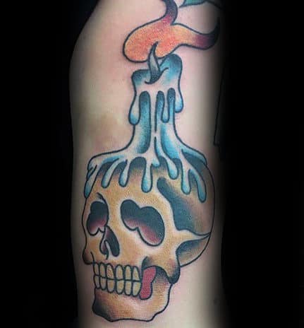 Blue Candle Dripping Wax On Skull Traditional Male Tattoo On Arm