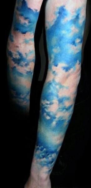 Blue Clouds Tattoo Sleeve On Man