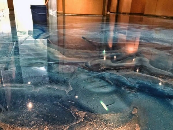 Blue and gray marbled epoxy concrete floor with a glossy, reflective surface indoors