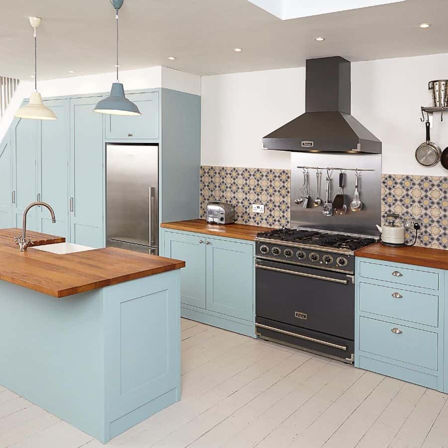 baby blue galley kitchen wood bench tops