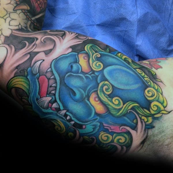 Blue Ink Bicep Guys Foo Dog Tattoo