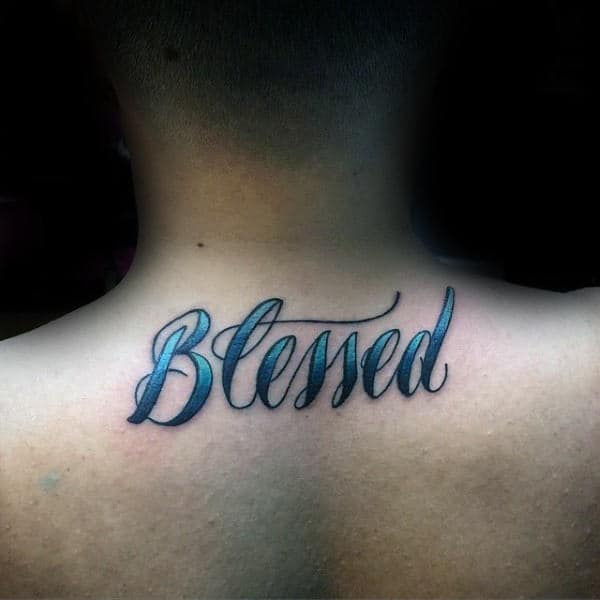 Blue Ink Blessed Word Tattoo On Mans Upper Back