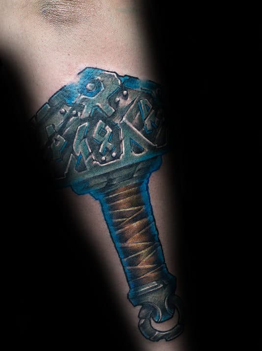 Blue Ink Mjolnir Mens Outer Forearm Tattoo Ideas