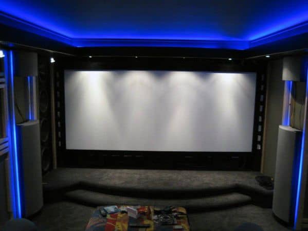 Modern movie room with blue LED crown molding lighting, creating a sleek cinematic ambiance
