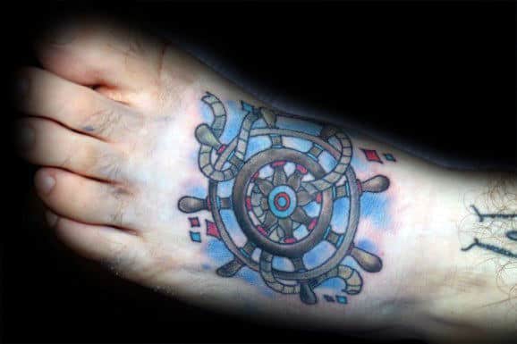 Blue Mens Ship Wheel Tattoo On Foot