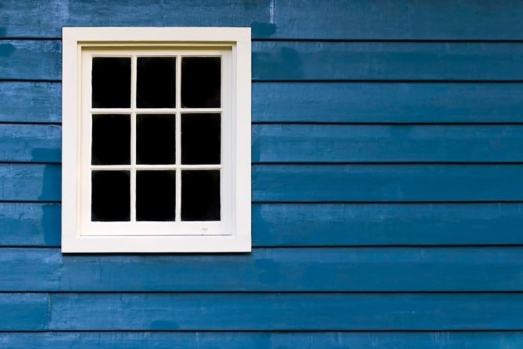 blue wall with white window frame