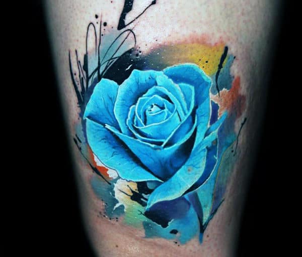 A vibrant blue rose tattoo with abstract splashes in the background