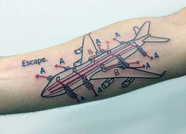 A tattoo of an airplane schematic labeled with "A" and "B," featuring the word "Escape" beside it