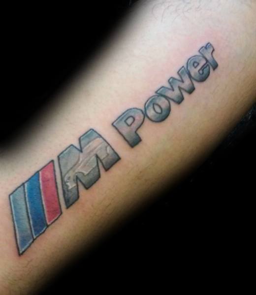 Bold BMW M Power tattoo on forearm, featuring the iconic tricolor stripes and 3D lettering for a dynamic motorsport-inspired design.