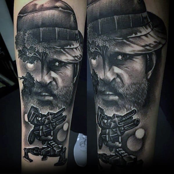 Realistic black and grey tattoo of Roland from Borderlands, featuring intense facial detail, a soldier silhouette, and his signature turret below.