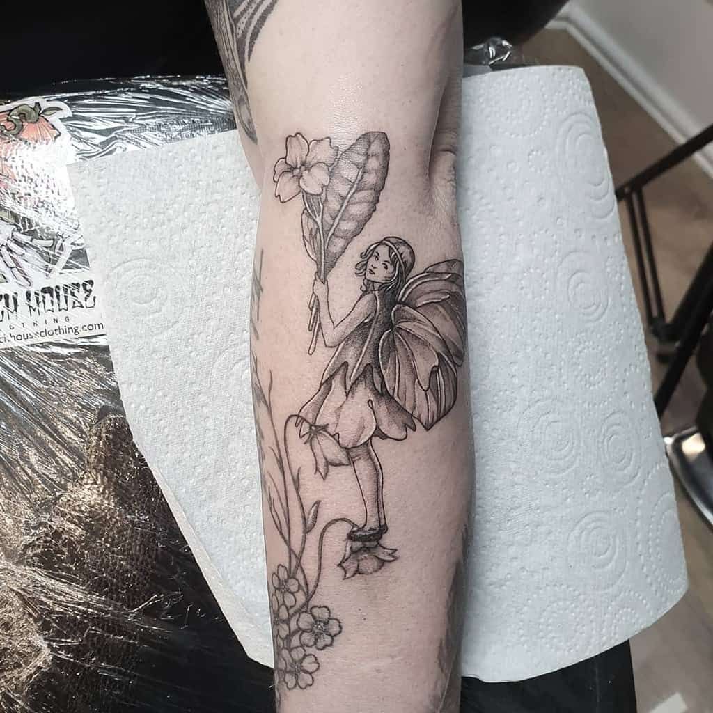 Botanical Whimsical Flower Fairy Tattoo