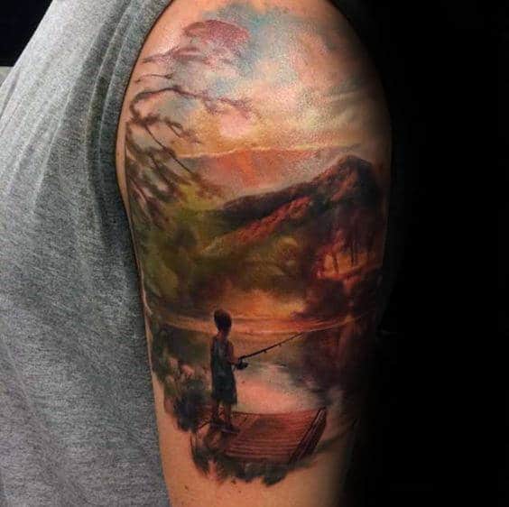 Boy Fishing At Lake Landscape Male Upper Arm Tattoo With Watercolor Designs