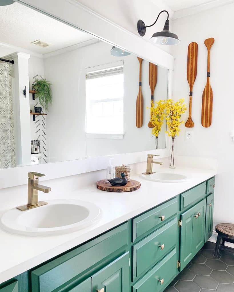 boys' bathroom green cabinets dual sinks oar wall art