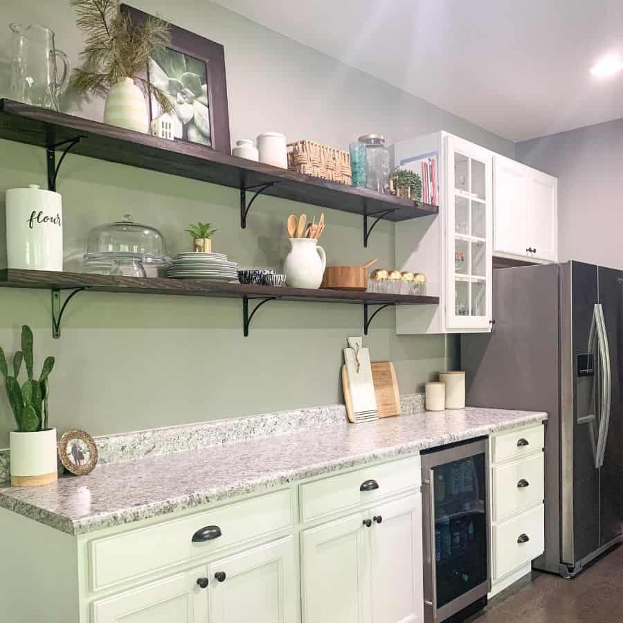 green kitchen wood wall shelves marble countertop