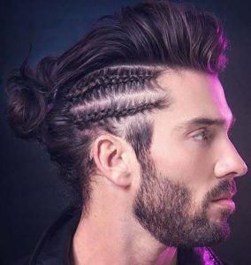 A punk Mohawk cut with long hair on top extending from front to the nape and braided sides