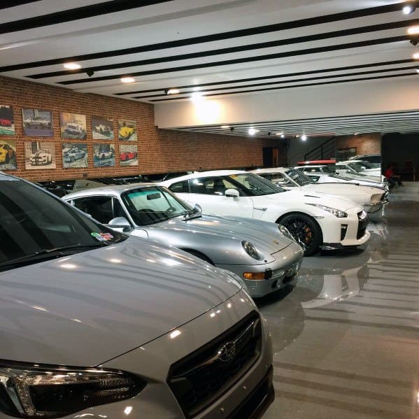 brick wall garage frame photos sports cars recessed ceiling lights 